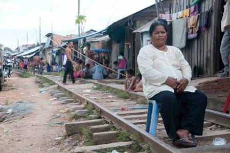 Woman sitting on railway