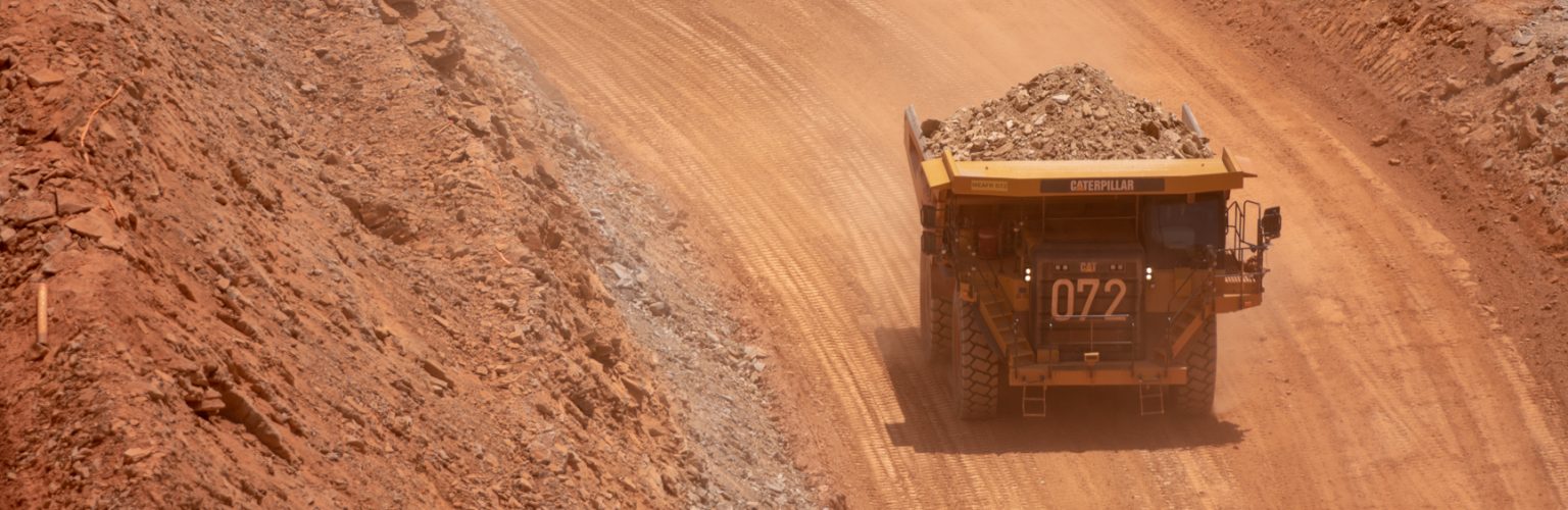 A truck carries bauxite from a mine in Guinea